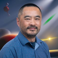 Xiaosong Li is pictured with a background of ultrafast molecules representing some of his research.