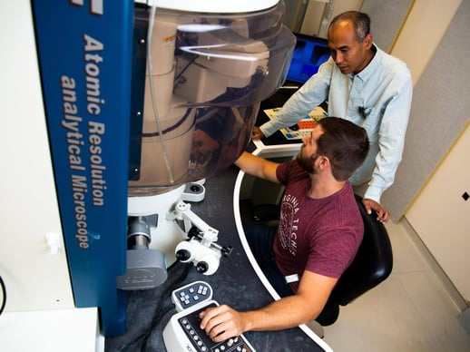 Wahyu Setyawan and Jacob Haag using an atomic resolution analytical microscope