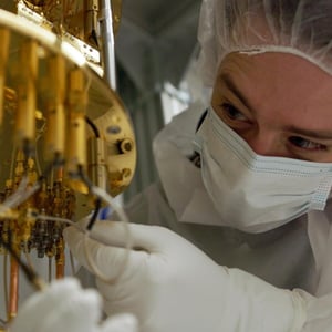 A man working with equipment in a laboratory.