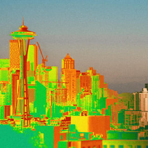Photo of the city of Seattle with a heat map covering it.