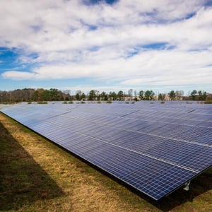 Photo of a field of solar panels.