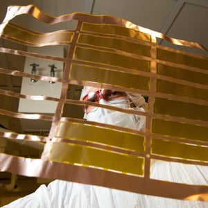 Photo of a scientist examining ultra-low radiation copper cables.